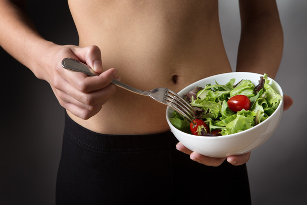 holding a bowl of salad - Photo, Image
