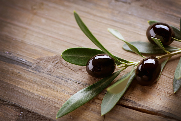 Olive over Wood Background - Фото, изображение