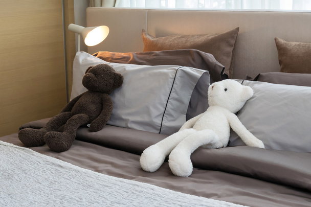 kids room with dolls and pillows on bed at home  - Foto, Bild