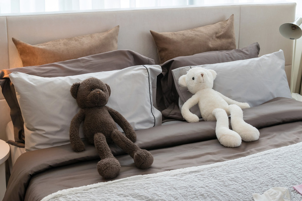 kids room with dolls and pillows on bed at home  - Fotografie, Obrázek