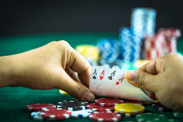 Gambling Hand Holding Best Game Card Series and Money Chips - Φωτογραφία, εικόνα