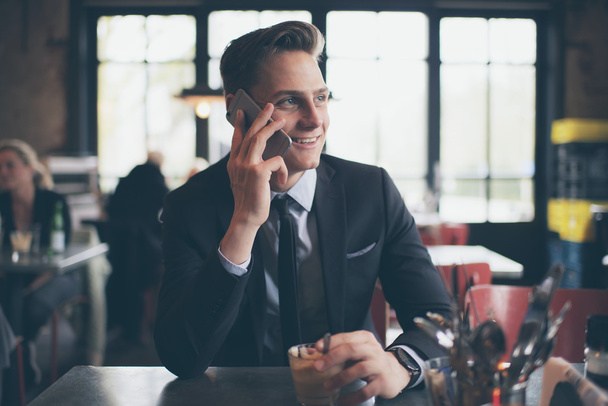 Smiling young businessman calling   - Photo, Image