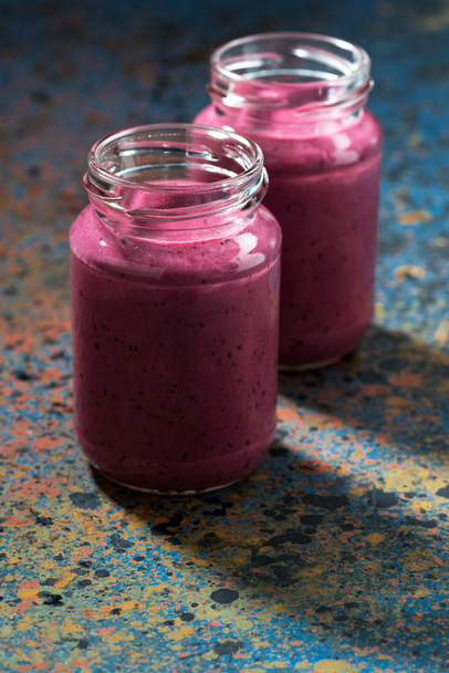 berry smoothie in bottles - Фото, изображение