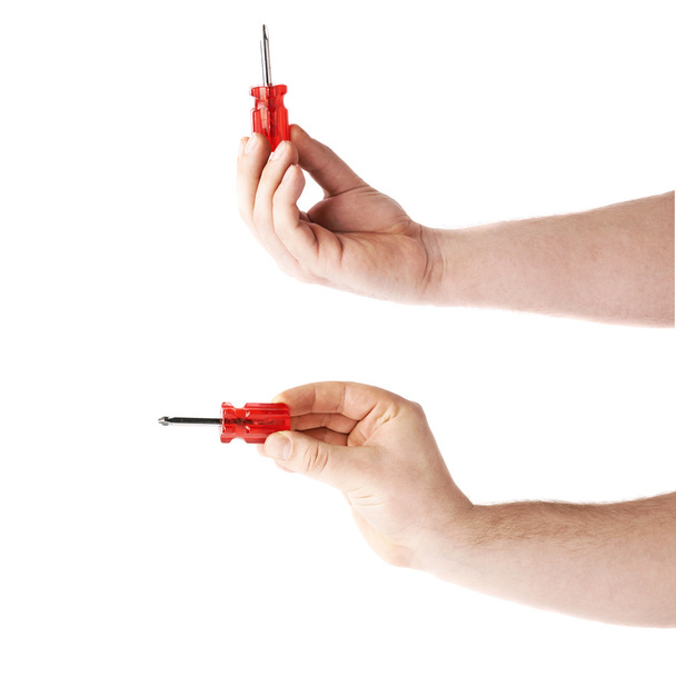Set of hand holding a screwdriver  tool, composition isolated over the white background - Zdjęcie, obraz