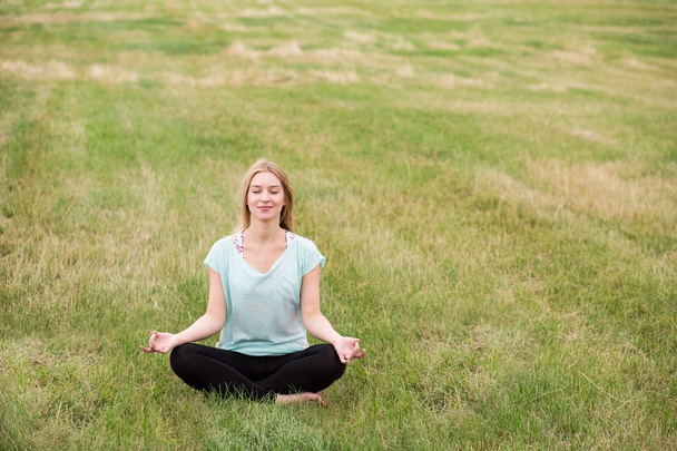 Practicing mindfulness meditation in nature - Foto, Imagen