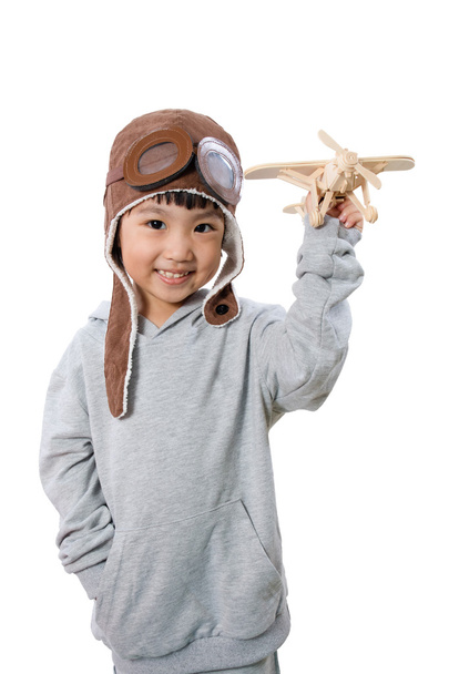 ásia pouco chinês menina jogar com brinquedo avião
 - Foto, Imagem