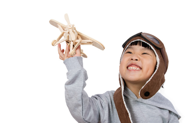 Asian Little Chinese Girl Playing with Toy Airplane - Photo, image