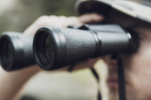 close up of soldier or hunter with binocular - Foto, Imagen