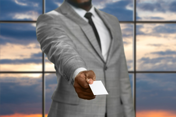 Black businessman giving visit card. - Photo, Image