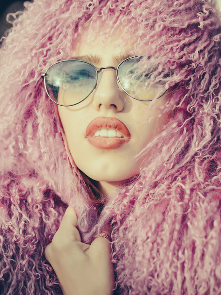Young woman in sunglasses - Фото, изображение