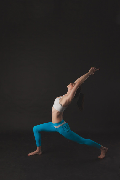 Beautiful sporty yogi girl practices yoga asana - Photo, image