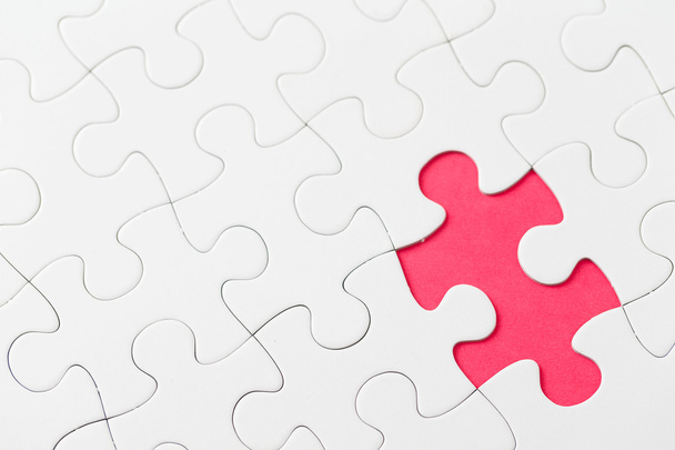 Puzzle with missing piece in red color - Foto, afbeelding