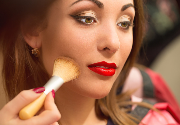 Professional makeup, applying face powder. - Photo, Image