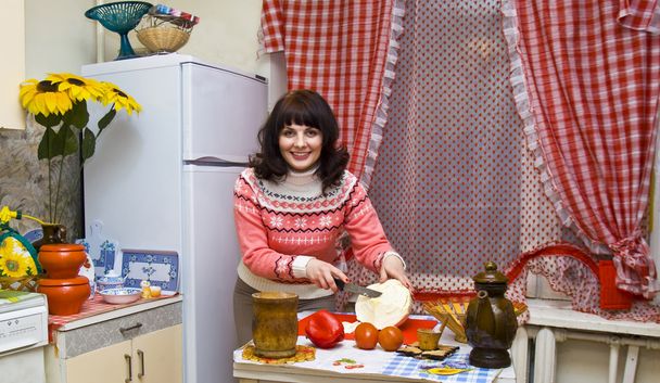 Woman in kitchen cooking - Foto, imagen