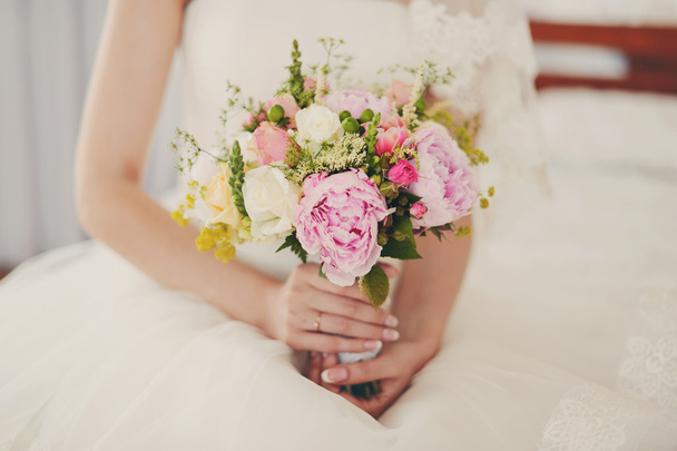 Very gentle wedding bouquet in hands of the bride - Фото, изображение