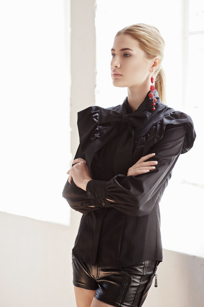 Blond woman in a black dress - Fotoğraf, Görsel
