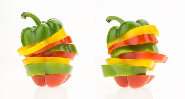 Two bell peppers sliced into colorful rings, isolated on white background. - Photo, image