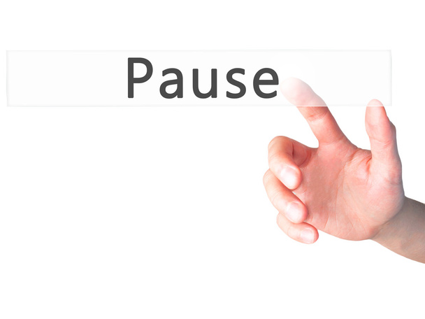 Pausa - Mano presionando un botón sobre el concepto de fondo borroso en
  - Foto, Imagen