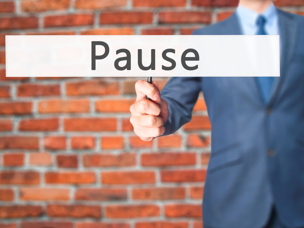 Pause - Businessman hand holding sign - Photo, Image