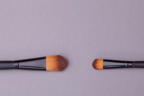 Many cosmetic brushes, overhead view. - Photo, Image