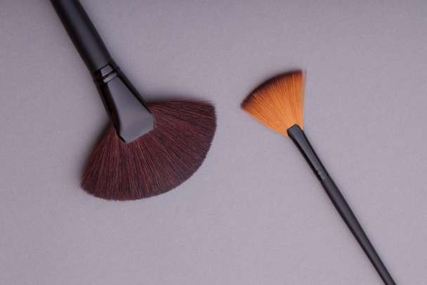 Many cosmetic brushes, overhead view. - Photo, Image