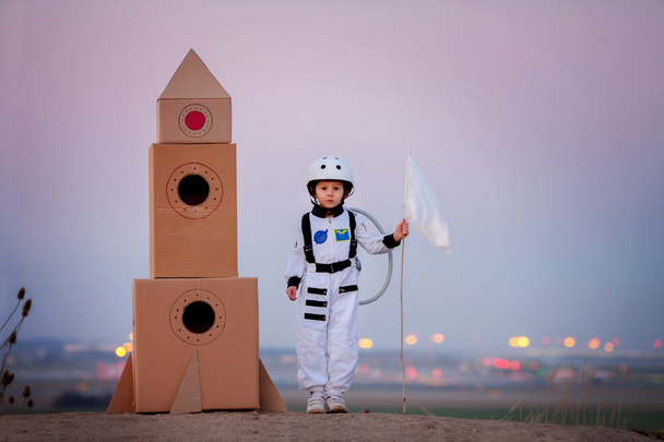 Adorable little boy, dressed as astronaut, playing in the park w - Foto, immagini