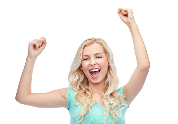щаслива молода жінка або дівчина-підліток, що святкує перемогу
 - Фото, зображення