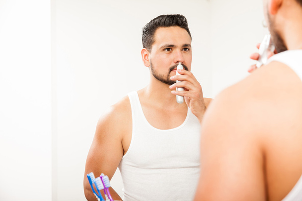 man with a beard trimming nose - Photo, Image