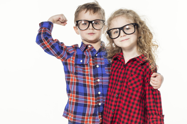 Funny lovely children.  fashionable little boy and girl in glasses, jeans, white t-shirts and plaid shirts. stylish kids in casual clothes in shocked. fashion children - Fotoğraf, Görsel