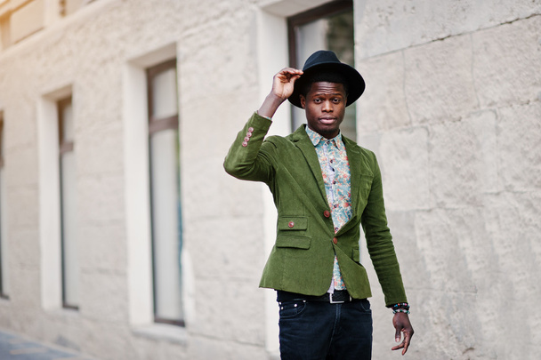 Fashion portrait of black african american man on green velvet j - Zdjęcie, obraz