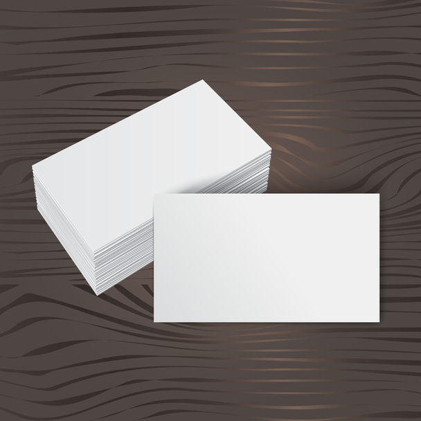 stack of blank business card on wooden background - Vector, Image