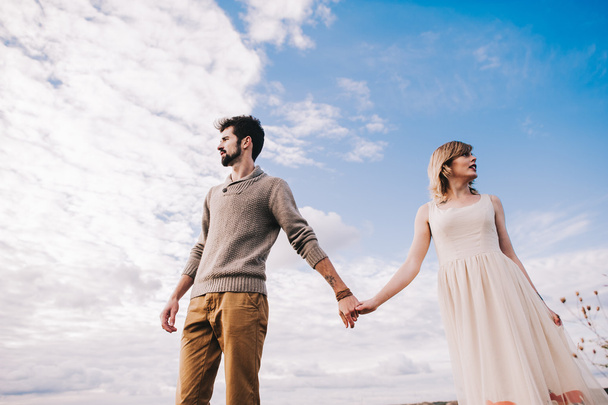 happy young couple holding hands - Foto, Imagen