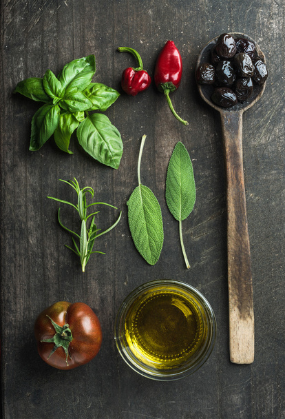 Vegetables and herbs on dark wooden background - Foto, afbeelding