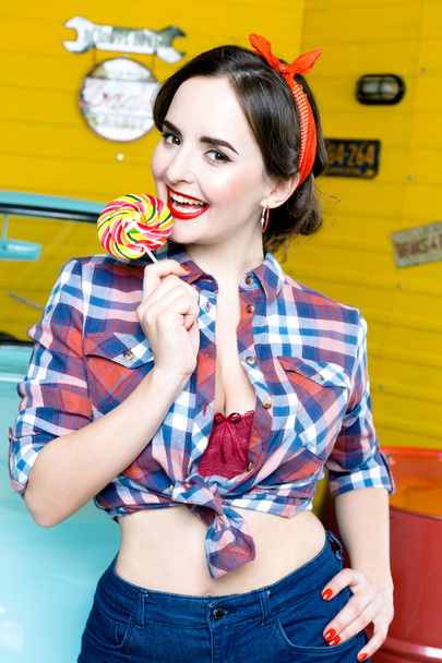 Woman With Pinup Style holding lollipop - Fotografie, Obrázek