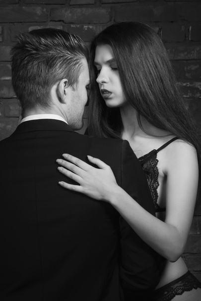 Beautiful young woman kissing her boyfriend - Photo, Image