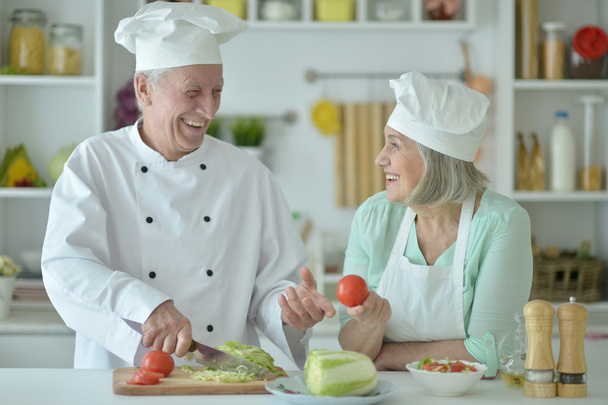 Senior couple at kitchen  - Фото, изображение