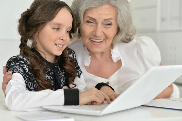 little girl making homework with granny - Photo, Image