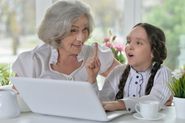 little girl making homework with granny - Photo, Image