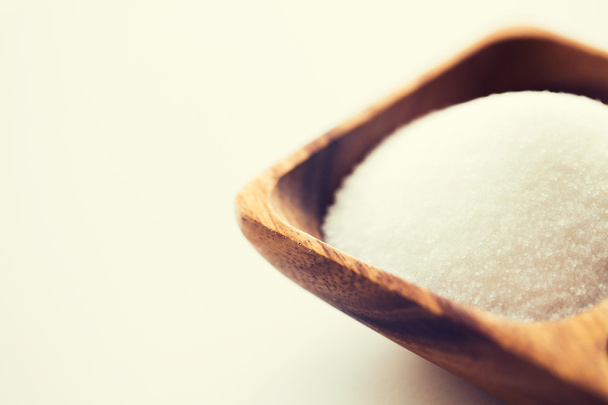 close up of white sugar heap in wooden bowl - Zdjęcie, obraz