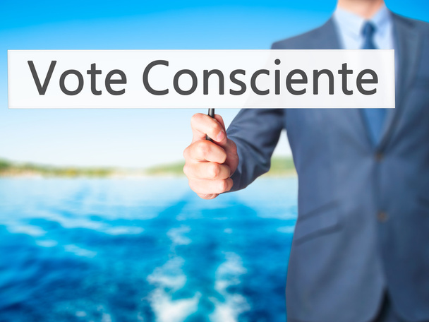 Vote Consciente - Businesswoman hand pressing button on touch sc - Photo, Image