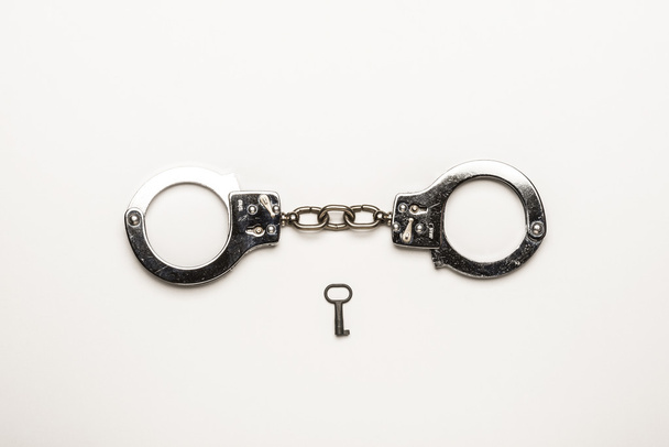 Silver handcuffs with key - Photo, Image