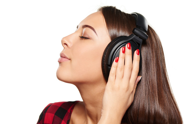 Female listening enjoying music in headphones with closed eyes - Φωτογραφία, εικόνα
