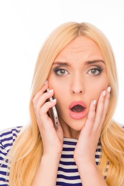 Surprised  woman with open mouth talking on phone and touching f - Photo, Image