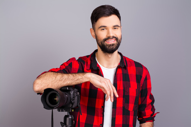 Attractive happy young photographer with big zoom lens  - Foto, Imagen