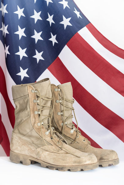 Old combat boots with American flag - Foto, afbeelding