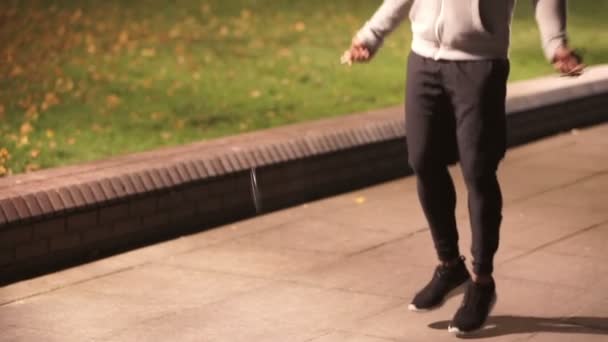 male skipping in urban environment - Materiał filmowy, wideo