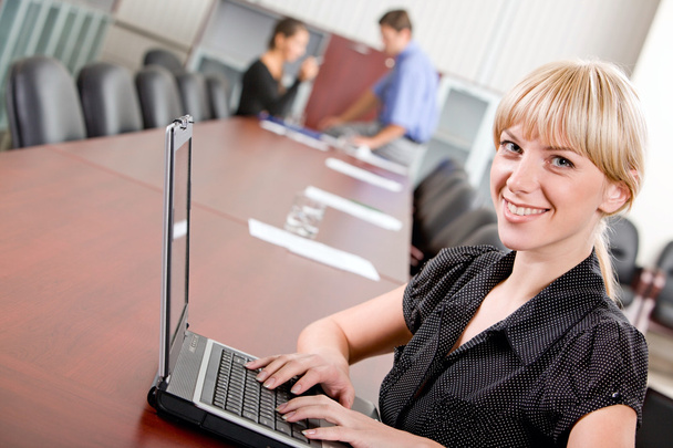 Portrait of pretty secretary looking at camera in working environment - Photo, Image