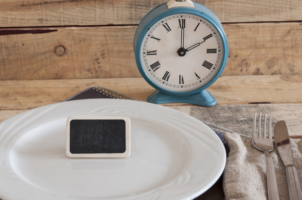  retro alarm clock on a plate - Foto, Bild