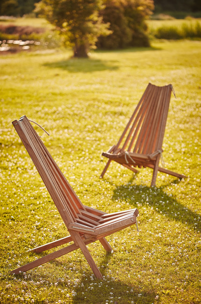 Two wooden chaise lounges - Fotó, kép