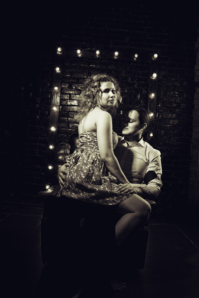 Young couple over brickwall - Foto, immagini